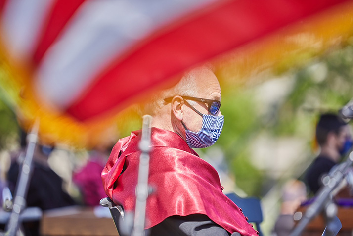 Board of Trustee Chair DeFred G. Folts III ’82 is framed by a flag.