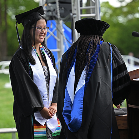 Ana Flood '25 accepts the Strauss Medal at Commencement.