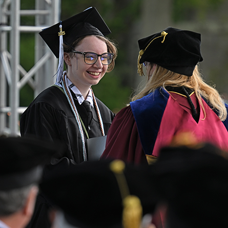 Owyn Ledina '25 accepts the Ames Prize at Commencement.